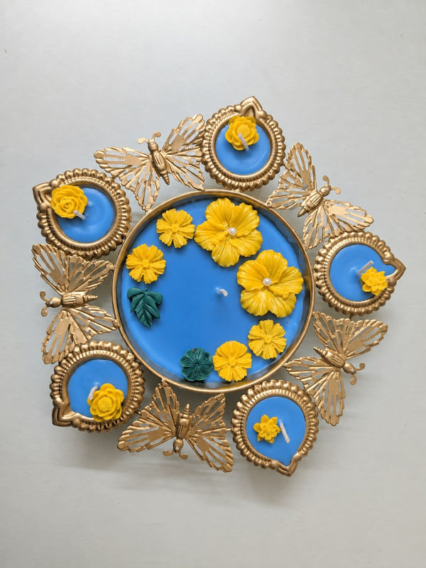 Gilded Butterfly & Floral Urli Candle – Handcrafted Festive centerpiece