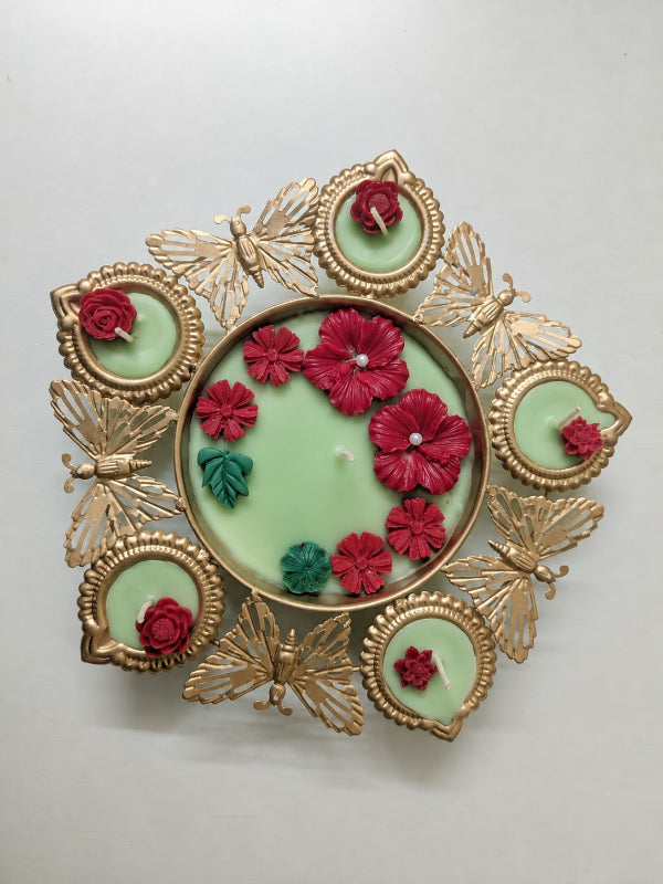 Gilded Butterfly & Floral Urli Candle – Handcrafted Festive centerpiece