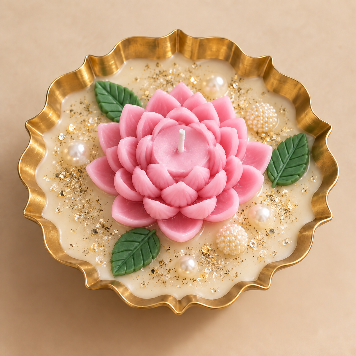 Lotus Glow Urli Candle in pink with gold bowl