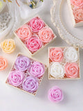 Three square gift boxes containing six miniature rose-shaped soaps in pastel pink, lavender, and white, arranged on a white surface with decorative props.
